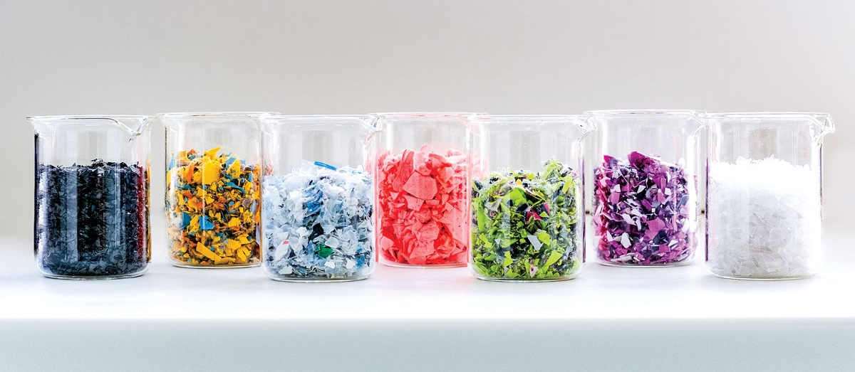 Five piles of shredded polyethylene terephthalate