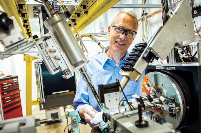 Brian Kobilka, 2012 Nobel Prize winner in chemistry places a sample in the micro X-ray beam at the GM/CA beamline at the Advanced Photon Source at Argonne National Laboratory.